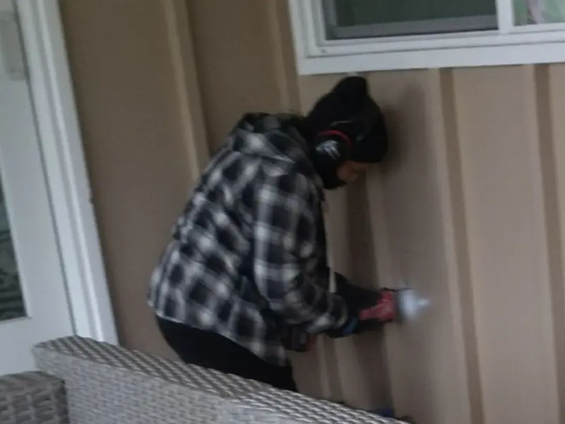 Professional electrician installing an exterior outlet in Homedale