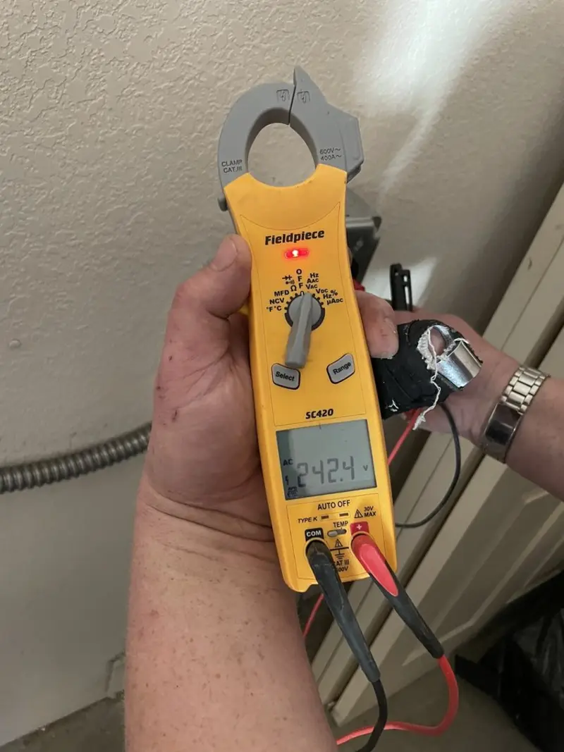 Voltage testing with clamp meter during Electrical Installation Services in Homedale